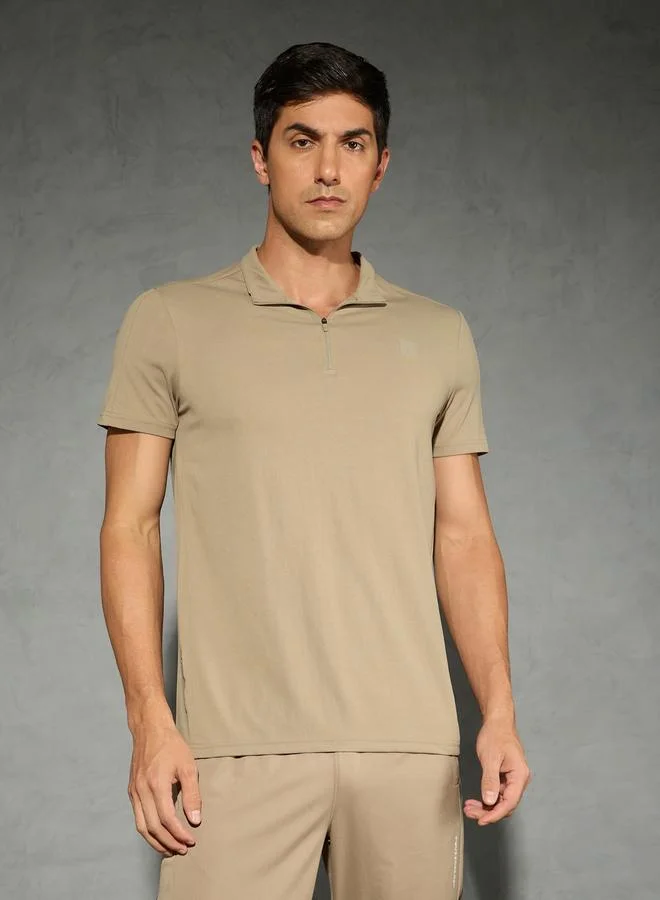 تكنوسبورت تيشيرت بولو تكنوسبورت بأكمام قصيرة مطاطية بلون سادة